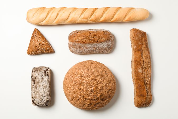 Flat lay composition with bakery products on blank background, space for text