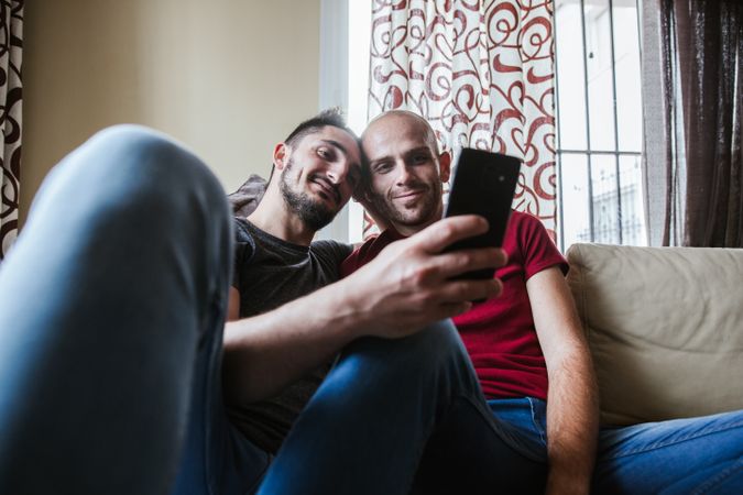 young gay couple at home