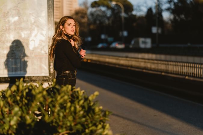 Woman hailing taxi