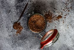 Top view of pot and spoon of flax seeds