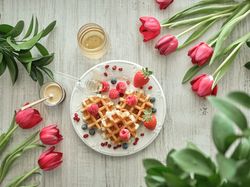 Sweet waffles amidst red tulips