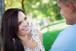 Happy Affectionate Couple Talking in the Park.