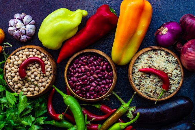 Fresh vegetables and grains on stone background with copy space