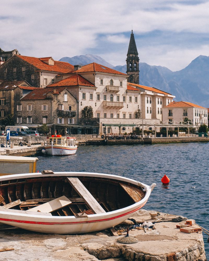 Boat on concrete dock on seashore near Kotor, Montenegro