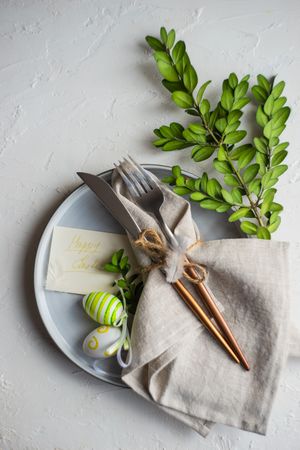 Easter table setting with branch and egg decor