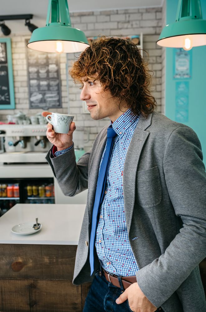 Man drinking coffee in a bar