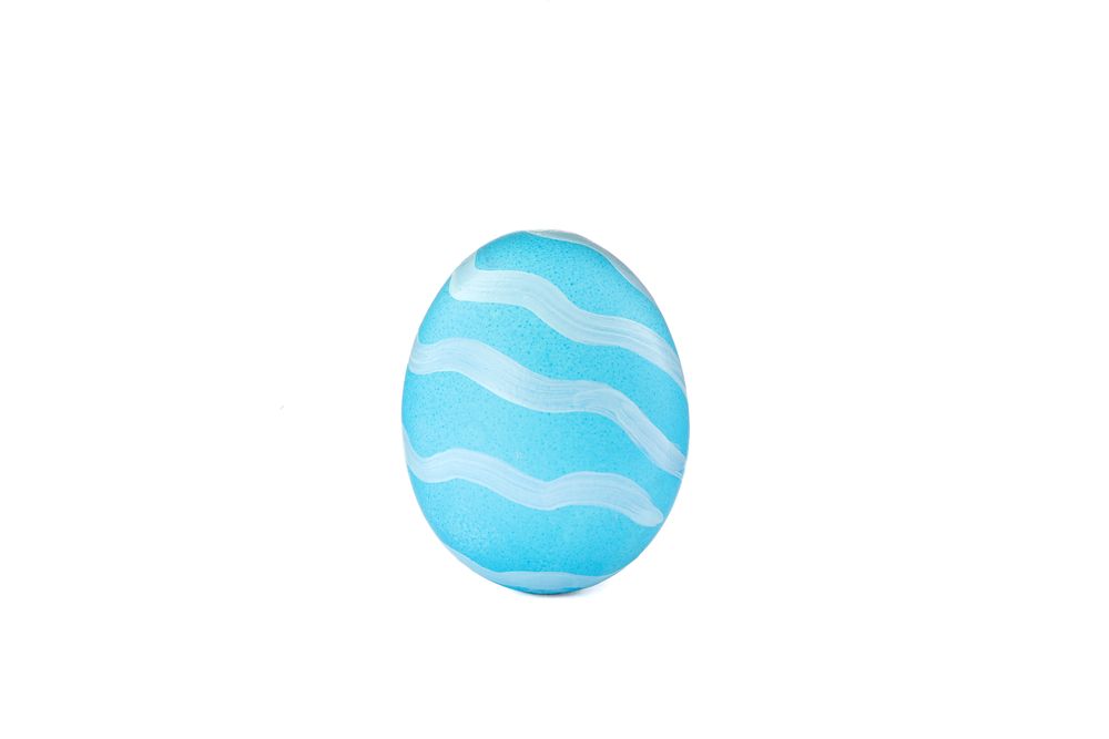 Decorative Easter egg isolated on light background. Festive tradition
