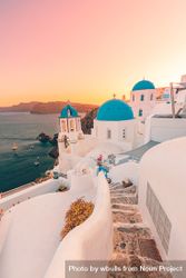 Hazy sunset in Santorini with blue domes 5l6XNb