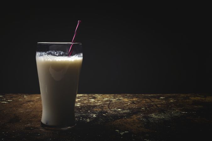Glass of milk on table