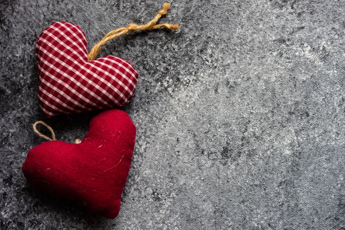 Valentine's day concept with red felt heart decorations on grey counter