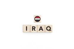 Wooden blocks bearing the name and flag of Iraq.