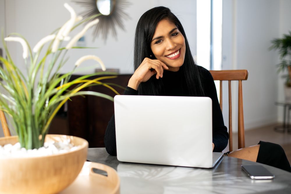Businesswoman working from home on her computer