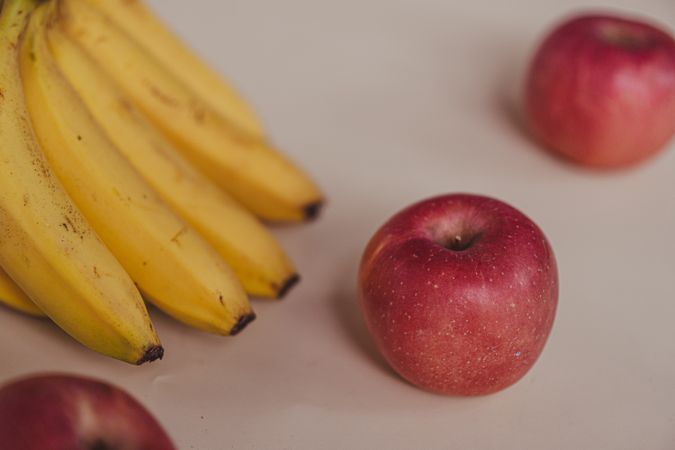 Fresh bananas and apples