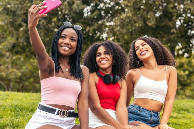 Young Friends Enjoying Summer Together and taking selfies