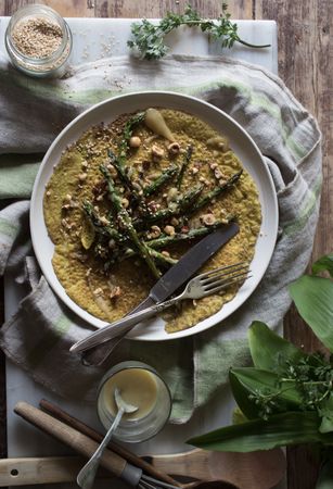 Served vegetarian crepe with oats and asparagus