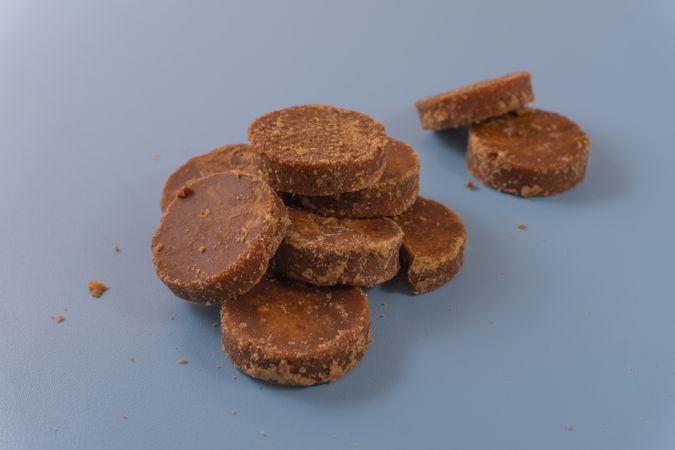 A stack of traditional palm sugar (gula merah) blocks arranged neatly