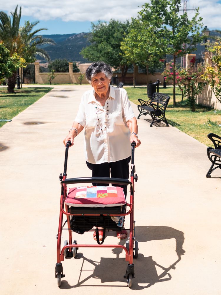 Mature woman with walker on street