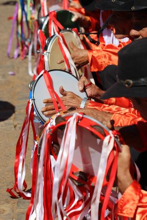 People playing tambourine at the traditional religious festival of Minas Gerais in Brazil