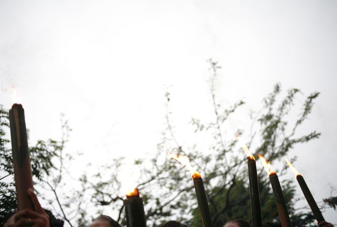 Top of torches being carried for Hindu prayers