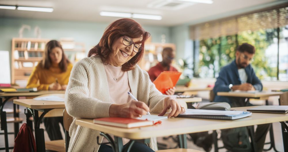 Portrait of Happy Mature Woman Taking a Course in an International Adult Education Center.
