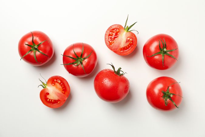Fresh ripe tomatoes on neutral background, top view