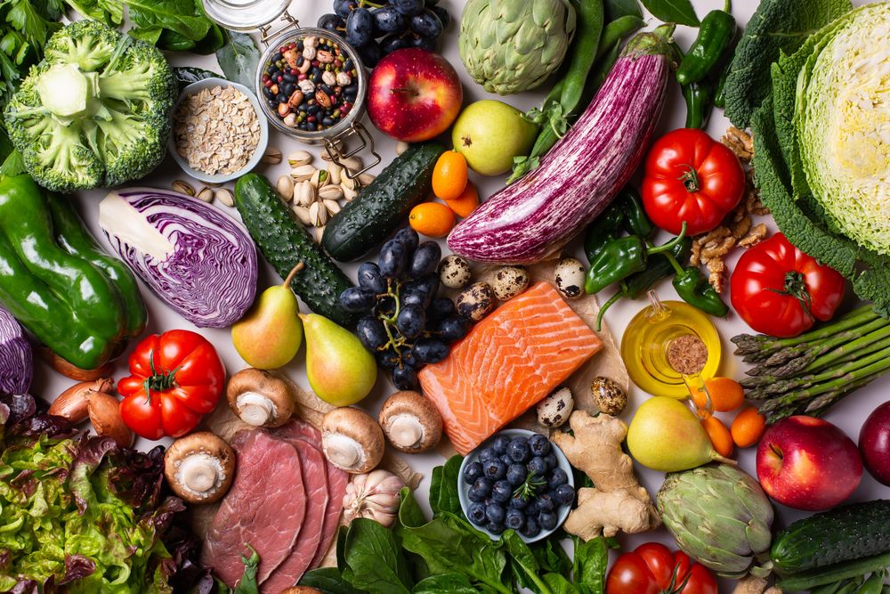 Top view of fresh vegetables, fruit and and fish