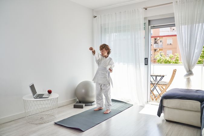 Child practicing judo at home