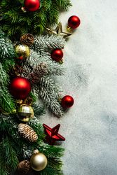 Christmas frame concept with pine branch and red baubles