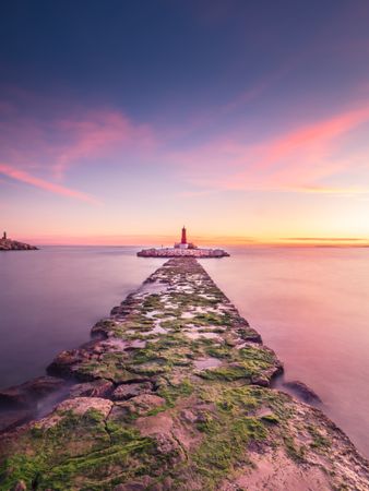 Rough path to islet with lighthouse