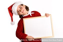 Girl in Santa costume holding blank board 4MLOy5