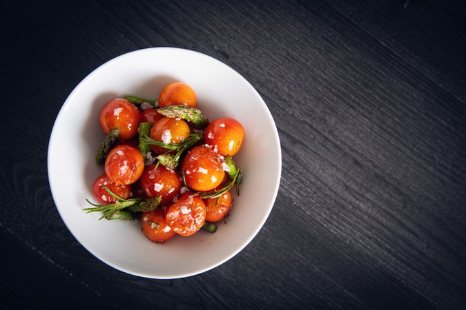 Fresh cherry tomatoes sauteed with green asparagus and rosemary