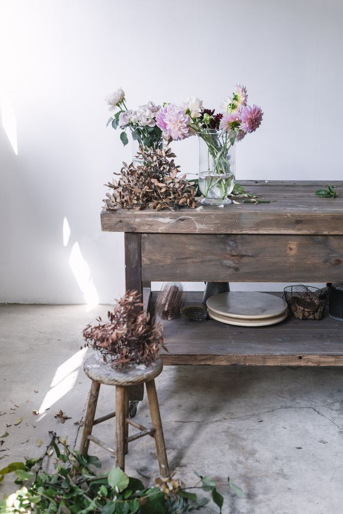Bunches of flowers in vases on table