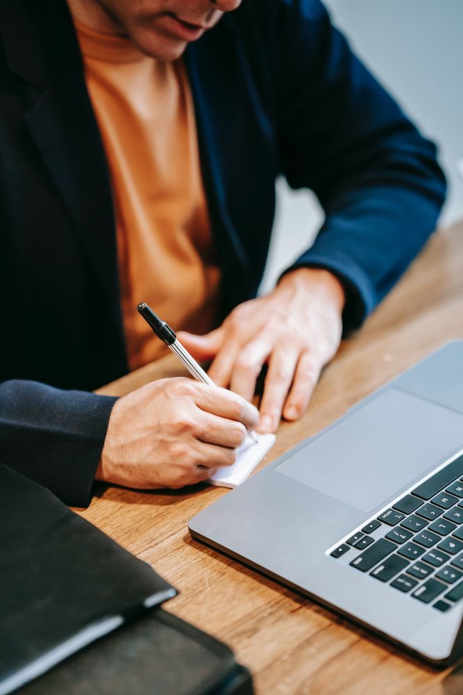 Businessman writing a note
