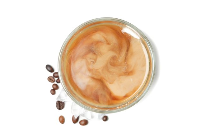 Glass of ice coffee isolated on plain background