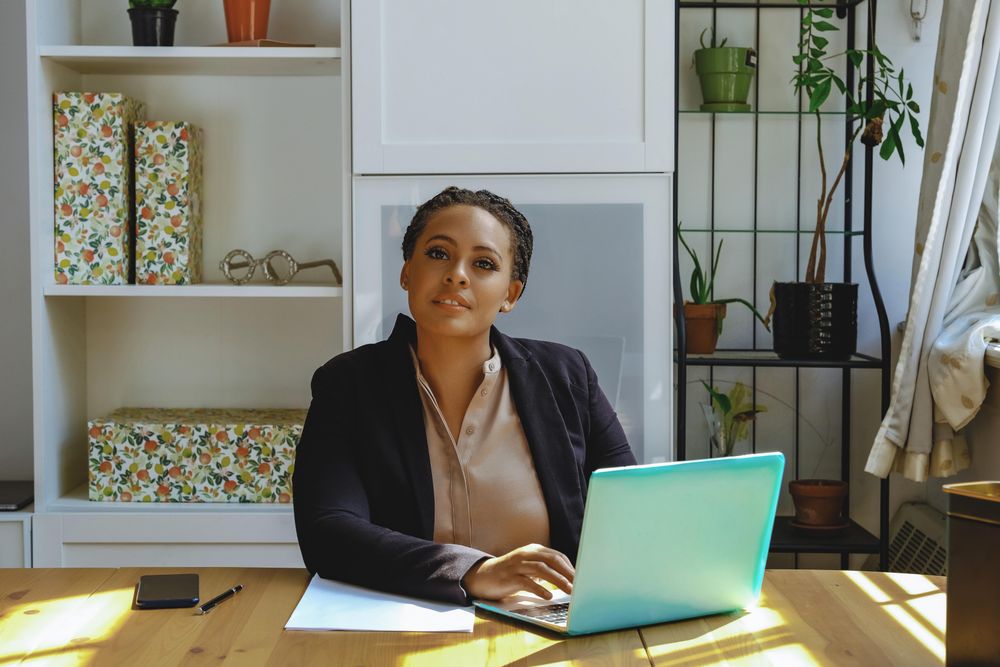 Serious business owner working in her home office