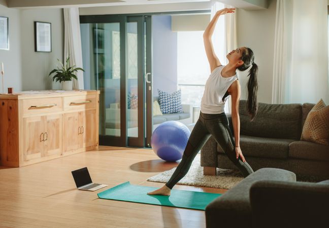 Woman working out in her living room