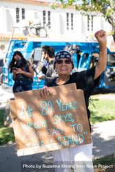 Los Angeles, CA, USA — June 7th, 2020: woman holds up protest sign at BLM event in East Los Angeles 5zr6j5