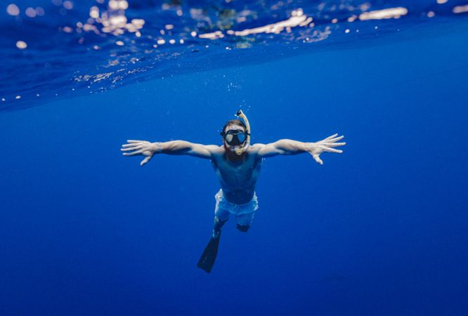 Underwater shot of man diving
