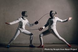 Two people playing fencing 0WAoy4
