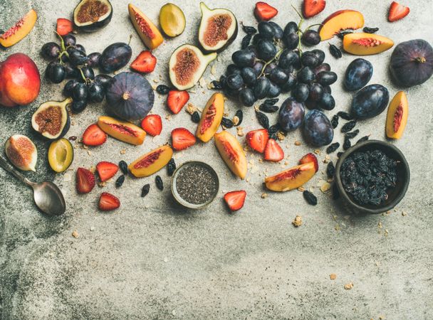 Fruit assortment with figs, grapes, peaches, chia seeds,  horizontal composition, copy space