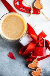 Top view of coffee with gift with red padlock