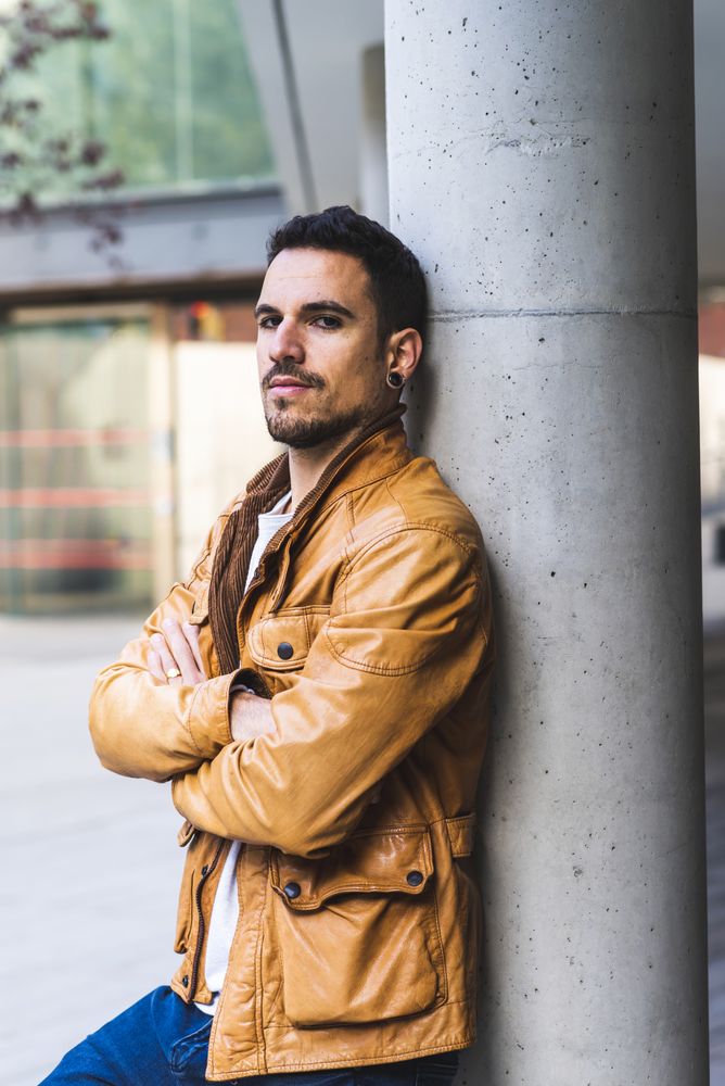 Stylish man outside modern building