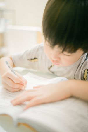 Boy solving his homework