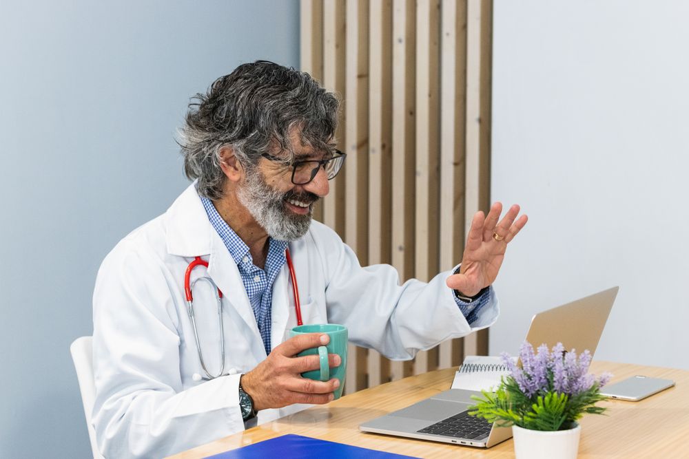 Doctor conducting telemedicine consultation with patient