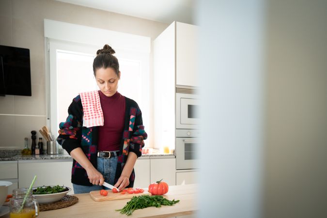 Woman preparing vegetable salad