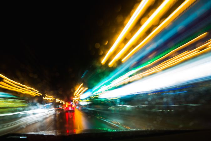 View of abstract shines on road through car window