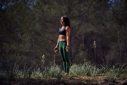Fit woman standing in Tadasana pose during yoga practice