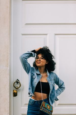 Fashionable Black female by door