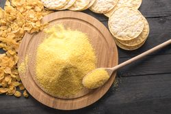 Top view of corn products and cornmeal on rustic table
