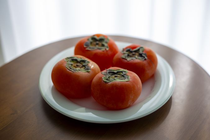 sweet persimmons on a plate